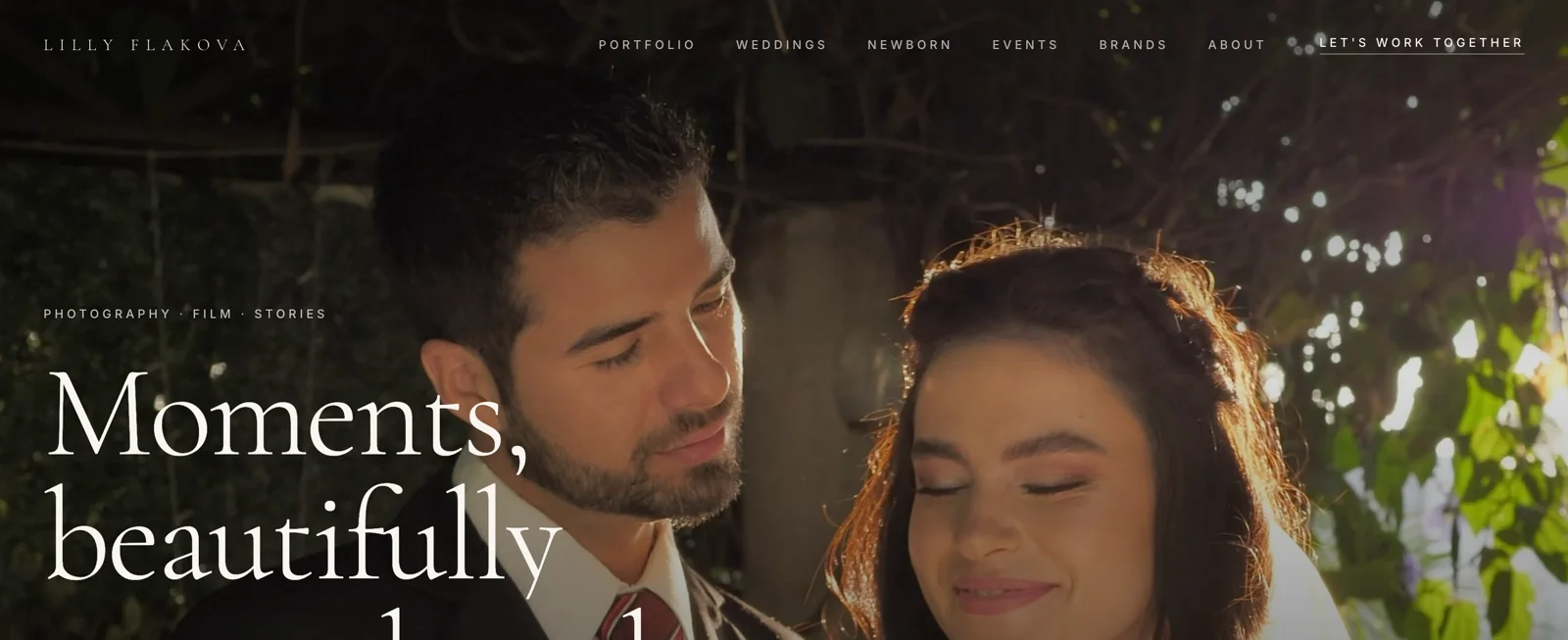 The Lilly Flakova homepage: a full-bleed wedding photograph behind the headline "Moments, beautifully remembered".